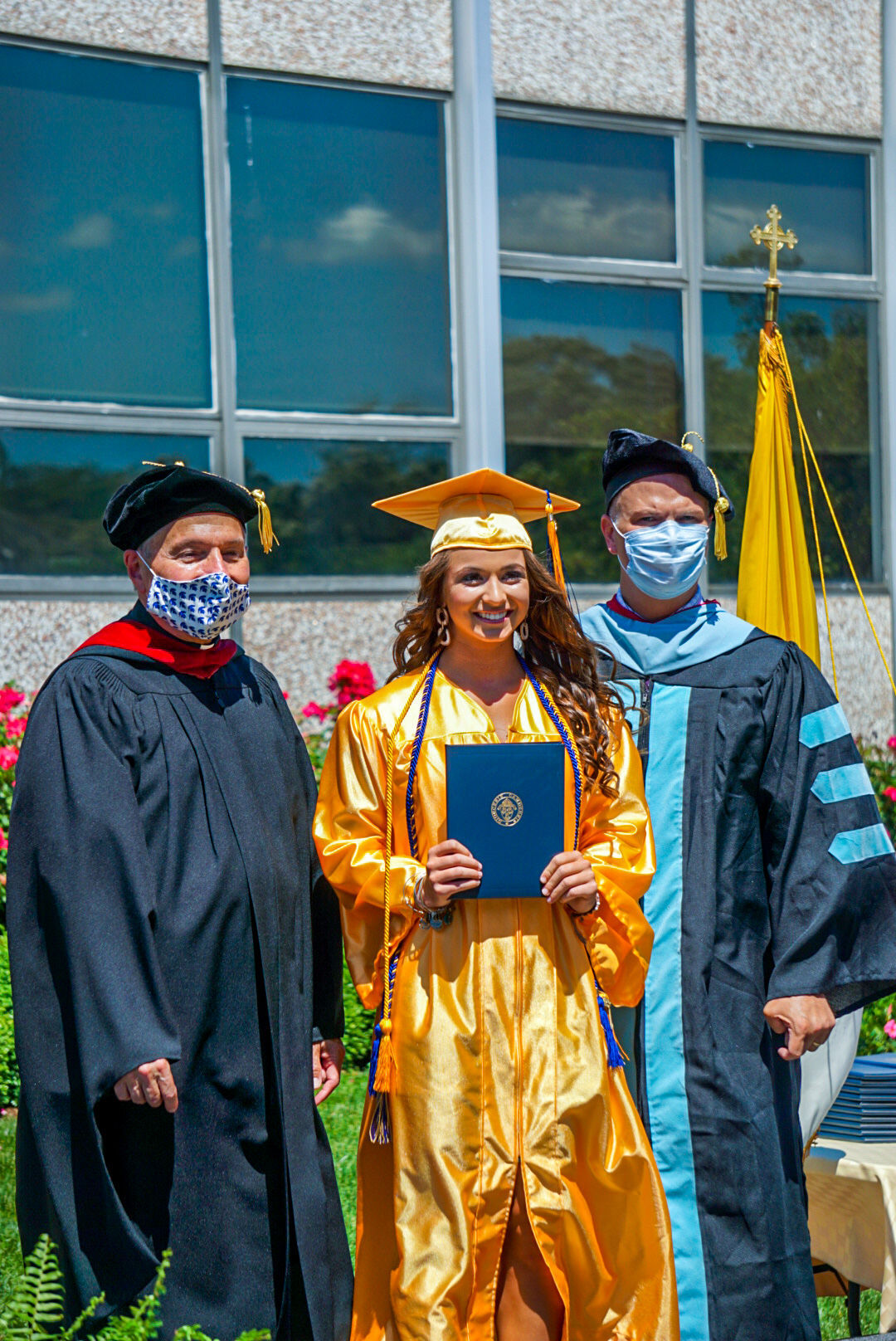 Holy Spirit drive-through diploma pickup